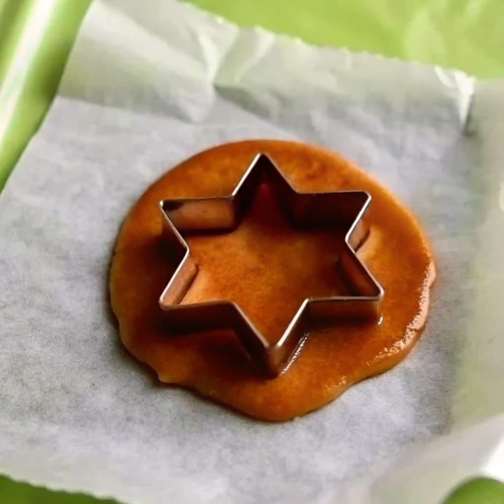 Squid Game Cookie Recipe – Proven Steps for Sweet Victory 9 Pressed Dalgona candy with umbrella shape
